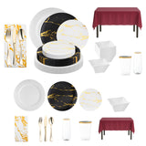 Bold black and gold dinner plates paired with elegant white and gold salad plates.