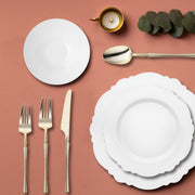 Classic white blossom rim plates arranged for a timeless wedding setting.