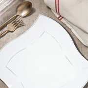 Clear Wave Dinner Plates presented entrees at a sleek modern party with transparent table decor