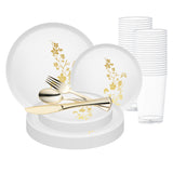 Elegant white and gold floral plastic plate set styled with matching cutlery and tumbler for a wedding dinner