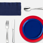 Guests enjoy burgers and desserts served on a vibrant red, white, and blue setup