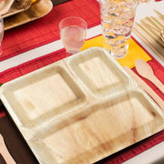 Square palm leaf 3-compartment dinner plates arranged on a table, ideal for serving meals with separate portions