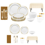 The Jingle Bells Set placed on a holiday table with gold fancy plates and glittering gold napkins.