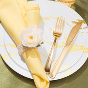 The White with Gold Marble Stroke Round Disposable Plastic Wedding Value Set provides the right amount of tableware, ensuring a full set for your guests and a seamless dining experience
