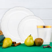 Transparent vintage-style plates and utensils enhance the clean look of a chic event table.