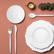 White plates with silver blossom rims add elegance to a festive tablescape.