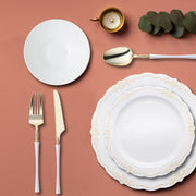 White with Gold Vintage dinnerware set arranged with blush and ivory decor.