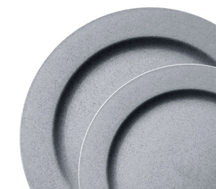 Two grey, round plates with a minimalist design, positioned slightly overlapping each other on a white background. The plates have a subtle speckled texture. The top plate partially covers the bottom plate, creating a layered appearance.