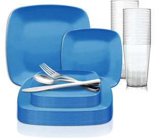 A set of blue, square-shaped dishes including dinner plates, salad plates, and bowls is stacked neatly with silver cutlery (fork, knife, and spoon) laid on top. In the background are several clear plastic tumblers stacked together.