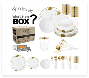 A set of disposable party tableware is displayed, featuring white plates with gold accents, clear plastic cups with gold trim, white cutlery with gold detailing, and gold utensils. A cardboard box labeled