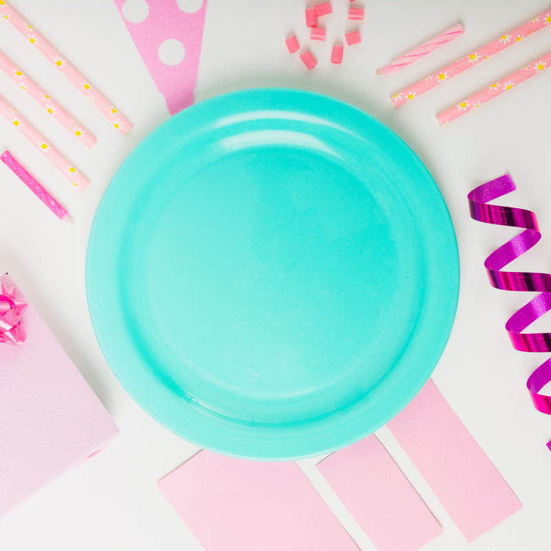 DIY supplies and disposable plates for personalized birth announcement ideas.