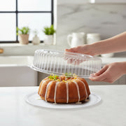 12" diameter clear round plastic tray with secure lid saves space on dessert tables and appetizer bars while keeping presentation pristine