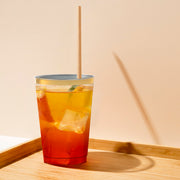 12 oz. Clear with Metallic Gold Rim Round Tumblers arranged with other tableware for a coordinated and elegant drink presentation
