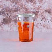 12 oz. Clear with Silver Dots tumblers placed on a celebration table, perfect for elegant drink presentation