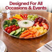 14" clear round trays set on a decorated table for a formal celebration or catered event