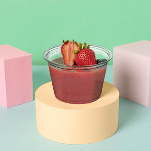 4oz plastic portion cups served condiments and dips during a casual buffet setup.