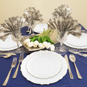 7.5" clear gold-rimmed plates held appetizers at a formal gathering with transparent decor.