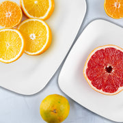 8.5-inch solid white disposable buffet plates with a stylish rounded square shape, sold in a 120-piece set for convenience.