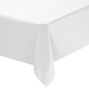 The Kaya Collection White Rectangular Linen-Like Tablecloths (50" x 108") are shown neatly draped over a corner of a table with sharp, clean lines, emphasizing the smooth texture and pristine condition of the fabric.