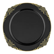 The Black with Gold Fancy Round Disposable Plastic Dinner Plates (10.25”) feature a glossy black surface and a decorative gold-patterned border with intricate, elegant designs. These plates have ornate edges that add a touch of sophistication to their simple, yet stylish appearance.