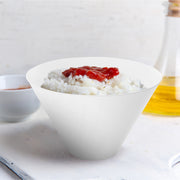 96 oz Deep Round Bowls in white served large salads at group dining setups.
