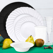 Arrangement of silver cutlery and ivory napkin atop white dinner plate.
