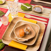 Beautiful table setting featuring square palm leaf eco-friendly plates, perfect for an elegant and sustainable meal