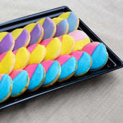 Black rectangular tray with groove rim featured in a formal event setting, perfect for elegant and modern food presentations