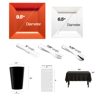 Bold orange plates and silver utensils used in a fan-centric dining setup.