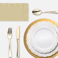 Buffet table display with gold charger plates and crystal-clear drinkware.