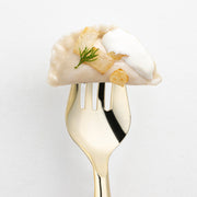 Case of 60 gold plastic serving forks, 9.75 inches long, durable and disposable for effortless serving.