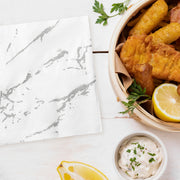 Chic and versatile, white and silver marble napkins enhance birthday parties, banquets, and corporate events