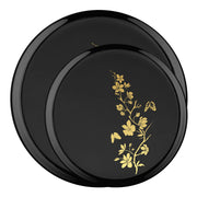 Chic black disposable plate set with gold floral rim accents styled for upscale party presentations