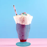 Chic dessert table styled with 15 oz Blue Milkshake Plastic Cups, perfect for milkshakes, sundaes, or frozen cocktails