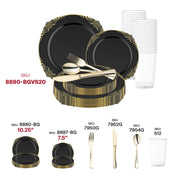 Chic event setting highlighted by Black with Gold Fancy Round Plastic Plates and gold cutlery on a luxury table layout