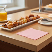 Classic pink disposable napkins for cocktails and beverages, measuring 10 by 10 inches when unfolded; sold in a 600-count pack.