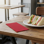 Classic red paper napkin placed at a formal table setting, 16 x 16 inches, from a large 600-count package