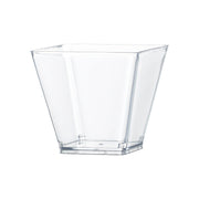 A stylish 3.5 oz. Clear Square Disposable Plastic Mini Cup with slightly flared sides sits on a white background, showcasing its translucent clear design.