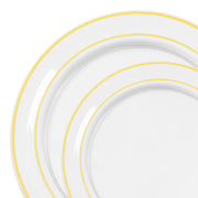 Clear 10.25" dinner and 7.5" salad plates with gold rims shown in elegant wedding place setting