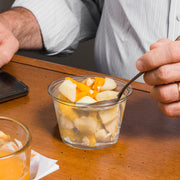 Clear Soufflé Cups with lids were used for sauces and dressings at a catering station.