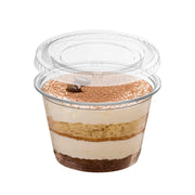 Clear lid securely placed on a 4 oz soufflé cup filled with sauce, ideal for takeaway and meal prep