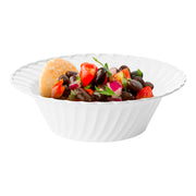 Clear plastic 5 oz. bowls with a modern flared edge, 5 inches across, disposable and convenient for formal or casual dining