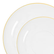Clear plastic dinner and salad plates with gold rims styled for upscale celebration table