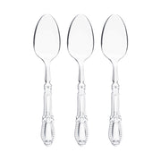 Clear plastic dinner spoons with refined Baroque engravings, combining durability with style for formal occasions