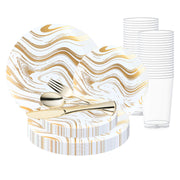 Complete wedding dinnerware set with clear tumbler, gold rim plate, and matching cutlery layout