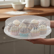 Crystal clear 12" high dome plastic lid for serving platters, stylish disposable catering cover for appetizer and dessert presentations.