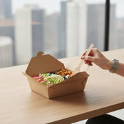 Customer carrying a kraft folded paper #3 container from a counter, sturdy natural brown takeout box for delivery, picnics, and boxed lunches.
