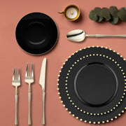 Decorative display of the Black with Gold Pearl String Round Disposable Plastic Tableware Set used for an event setup