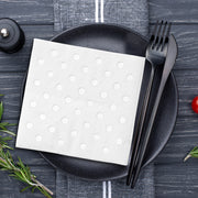 Delicate silver polka dot napkins on crisp white paper, adding charm and elegance to drink stations and dessert tables