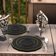 Designed for events, Black with Gold Rim Round Blossom Disposable Plastic Appetizer/Salad Plates brings contemporary flair to tablescapes and buffet spreads
